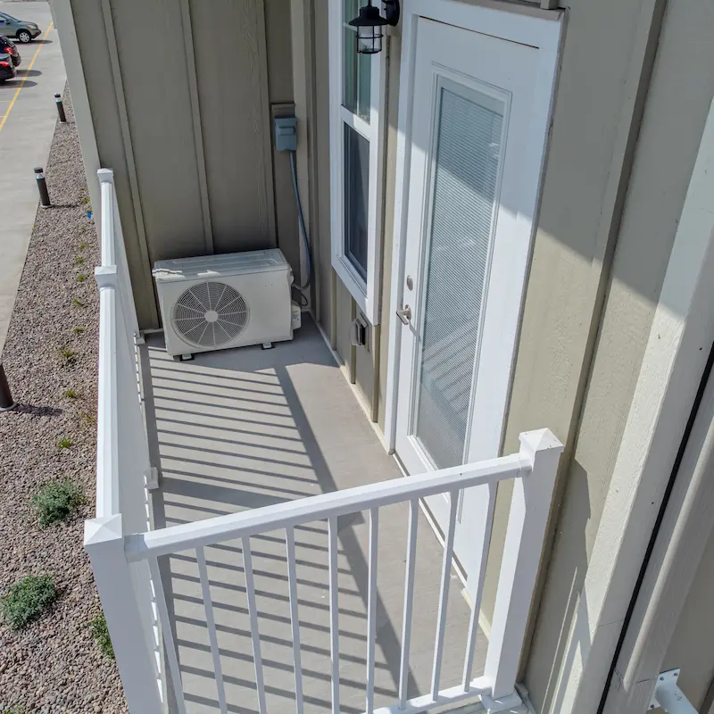 ductless heat pump condenser on balcony