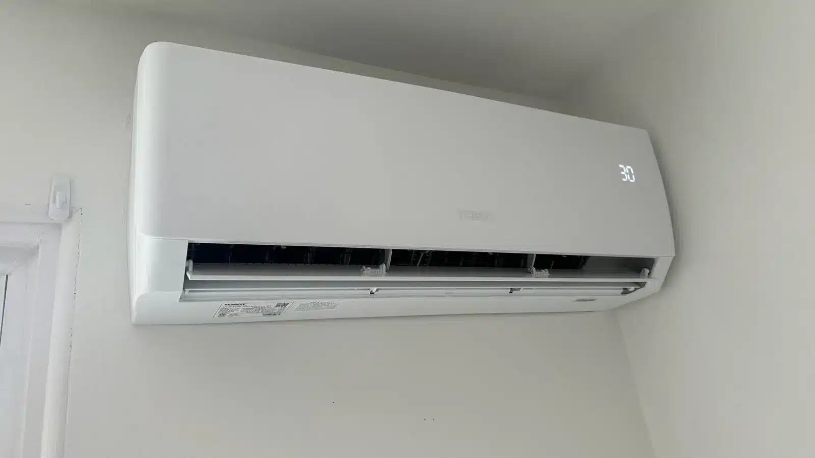 evaporator head of heat pump mounted on a wall