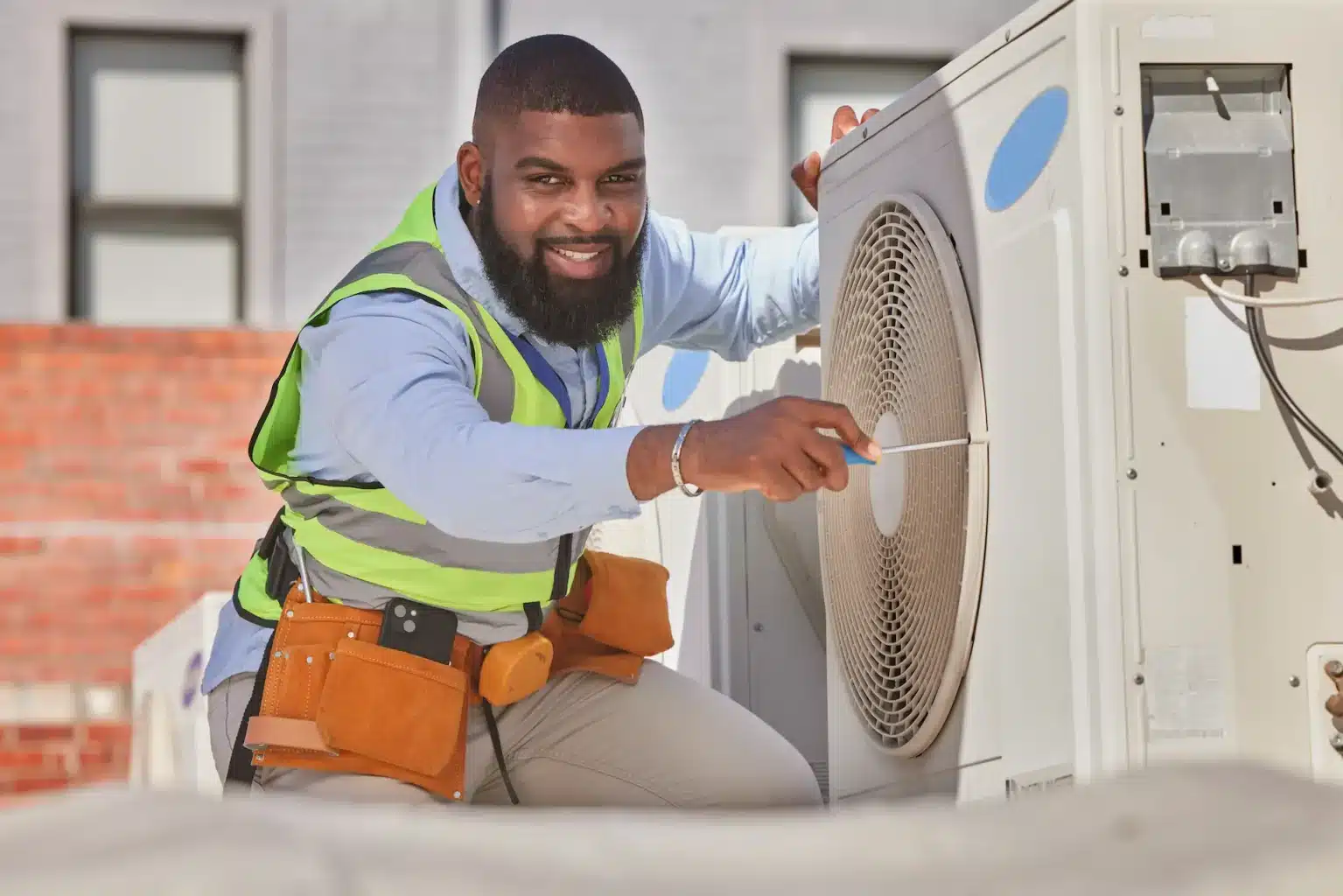 hvac tech conducting expert cooling services with air conditioning installation