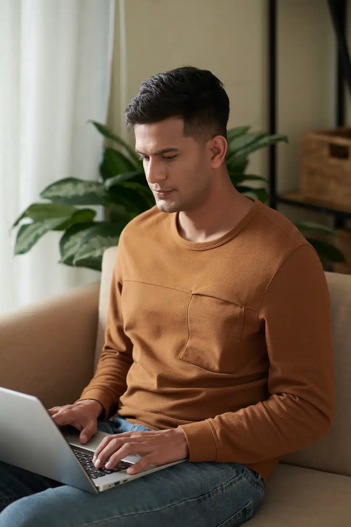 man getting a quote on laptop at home